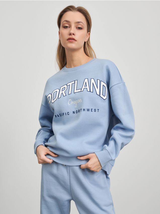 bluzy-sinsay-988txz-1.jpg Bluza z nadrukiem Kolor błękitny SINSAY 7435F 05X - obrazek 1
